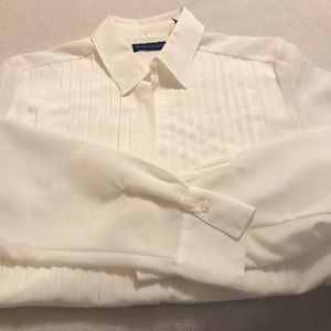 Cream colored long sleeved dress blouse.